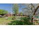 A landscaped backyard with mature trees, a hammock, and a water feature at 761 S Eighth St, Mebane, NC 27302