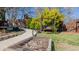 A walking path to a wooden swing in a landscaped backyard with a wooden fence at 761 S Eighth St, Mebane, NC 27302