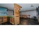 Basement featuring a kitchenette bar with seating, dark laminate flooring and comfortable seating at 761 S Eighth St, Mebane, NC 27302
