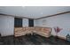 Spacious basement featuring laminate flooring and comfortable seating and wall decor at 761 S Eighth St, Mebane, NC 27302