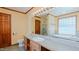 Well-lit bathroom features a tub, shower, and vanity with ample counter space at 761 S Eighth St, Mebane, NC 27302
