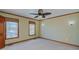 Neutral bedroom with hardwood floors, a ceiling fan, and natural light from the windows at 761 S Eighth St, Mebane, NC 27302