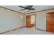 Spacious bedroom offers wood trim, natural light, and a connecting bathroom at 761 S Eighth St, Mebane, NC 27302