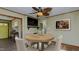 Bright dining room with hardwood floors and a modern ceiling fan creates a welcoming space at 761 S Eighth St, Mebane, NC 27302