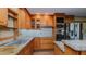 Traditional-style kitchen with light wood cabinets, granite countertops, and stainless steel appliances at 761 S Eighth St, Mebane, NC 27302