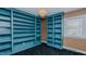 Open library shows the custom blue built-in shelving and light from the window at 761 S Eighth St, Mebane, NC 27302
