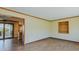 Open-concept living room showcasing hardwood floors with view to outdoor deck and kitchen at 761 S Eighth St, Mebane, NC 27302