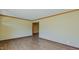 Spacious living room with hardwood floors, neutral wall paint, and ample electrical outlets at 761 S Eighth St, Mebane, NC 27302
