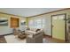 Staged living room featuring a bay window, hardwood floors, and comfortable seating at 761 S Eighth St, Mebane, NC 27302