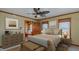 Inviting main bedroom boasts natural light, wood trim, and adjoining sitting room at 761 S Eighth St, Mebane, NC 27302