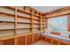 Charming window seat with built-in shelving and cabinet storage, great for relaxing or reading at 761 S Eighth St, Mebane, NC 27302