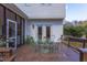 Charming deck with seating area and access to screened porch, perfect for outdoor entertaining at 7816 Tylerton Dr, Raleigh, NC 27613