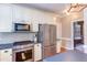 Beautiful kitchen equipped with stainless steel appliances and custom cabinets at 7816 Tylerton Dr, Raleigh, NC 27613