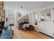 Warm and inviting entryway with wood floors, a staircase, and an area perfect for a home office at 7917 Holly Springs Rd, Raleigh, NC 27606