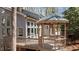 Backyard gazebo next to large windows of home surrounded by a deck at 7917 Holly Springs Rd, Raleigh, NC 27606