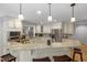 Modern kitchen featuring granite countertops, stainless steel appliances, and bar stool seating at 7917 Holly Springs Rd, Raleigh, NC 27606