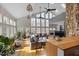 Bright living room featuring hardwood floors, floor to ceiling windows, and modern decor at 7917 Holly Springs Rd, Raleigh, NC 27606