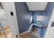 Staircase featuring blue walls, a window, and carpeted steps at 7917 Holly Springs Rd, Raleigh, NC 27606