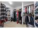 Organized walk-in closet with shelving, hanging racks, and space for shoes and accessories at 7917 Holly Springs Rd, Raleigh, NC 27606