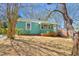 Charming bungalow with front porch, landscaped yard, and mature tree at 810 Cox Ave, Durham, NC 27701