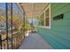 View of a covered front porch showing metal railings and siding at 810 Cox Ave, Durham, NC 27701