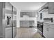 Modern kitchen with stainless steel appliances and bright lighting at 810 Cox Ave, Durham, NC 27701