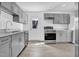 Updated kitchen with stainless steel appliances and ample cabinet space at 810 Cox Ave, Durham, NC 27701
