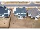 Overhead shot of a home with a spacious backyard, patio, and screened porch in a residential neighborhood at 83 Inspiration Way, Fuquay Varina, NC 27526