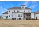 Large backyard features a patio with outdoor seating and room to play at 83 Inspiration Way, Fuquay Varina, NC 27526