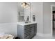 Modern bathroom with gray cabinets, stylish mirror, and neutral color palette at 83 Inspiration Way, Fuquay Varina, NC 27526