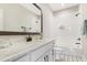 Bright bathroom featuring a marble countertop vanity, a subway tile tub and classic fixtures at 83 Inspiration Way, Fuquay Varina, NC 27526