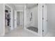 Elegant bathroom with a glass shower, open entry to closet, and neutral color palette at 83 Inspiration Way, Fuquay Varina, NC 27526