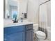 Bathroom features a blue vanity cabinet at 83 Inspiration Way, Fuquay Varina, NC 27526