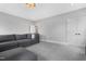 Open bonus room with a neutral color palette and comfortable seating at 83 Inspiration Way, Fuquay Varina, NC 27526