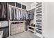 Custom walk-in closet offering ample storage solutions with drawers and racks at 83 Inspiration Way, Fuquay Varina, NC 27526