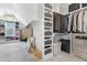 Spacious walk-in closet with custom shelving and ample storage space at 83 Inspiration Way, Fuquay Varina, NC 27526