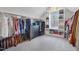 Large walk-in closet with clothes racks, shelving, and natural light at 83 Inspiration Way, Fuquay Varina, NC 27526