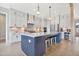 Spacious kitchen with stainless appliances, gas cooktop, large island, and great lighting at 83 Inspiration Way, Fuquay Varina, NC 27526