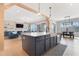 Open kitchen featuring a large center island and modern appliances, connecting to the living area at 83 Inspiration Way, Fuquay Varina, NC 27526