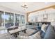 Spacious living area connects to a screened patio and kitchen, offering natural light and modern finishes at 83 Inspiration Way, Fuquay Varina, NC 27526