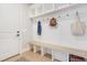 Bright mudroom with storage cubbies, bench seating, and hooks at 83 Inspiration Way, Fuquay Varina, NC 27526