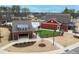 Aerial view of community pool with bath house, landscaping, and seating areas at 83 Inspiration Way, Fuquay Varina, NC 27526