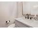 Powder room features a black faucet and marble countertop at 83 Inspiration Way, Fuquay Varina, NC 27526