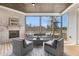 Charming screened-in porch with a cozy fireplace and comfortable seating area at 83 Inspiration Way, Fuquay Varina, NC 27526