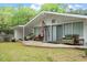 A charming patio space with wicker furniture offers a relaxing outdoor area at 911 Williams Rd, Raleigh, NC 27610