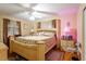 Spacious bedroom featuring a large bed with patterned bedding and bedside tables at 911 Williams Rd, Raleigh, NC 27610