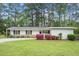 Charming single story home with landscaped front yard and colorful azaleas, offers great curb appeal at 911 Williams Rd, Raleigh, NC 27610