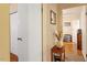 Hallway featuring simple decor and a small table with storage shelves and drawers at 911 Williams Rd, Raleigh, NC 27610