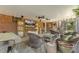 A covered back patio with brick walls, a ceiling fan, a TV, and outdoor furniture at 105 Blanchard St, Fuquay Varina, NC 27526