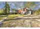 Large backyard showcasing a spacious lawn, patios, and outdoor living spaces at 105 Blanchard St, Fuquay Varina, NC 27526